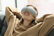 © megaflopp - Relaxed woman enjoys eye massage wearing special goggles