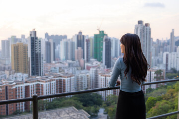 Poster - Woman enjoy the city view in Hong Kong