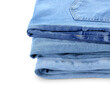 © Pixel-Shot - Stack of jeans on white background, closeup
