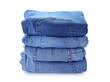 © Pixel-Shot - Stack of jeans on white background
