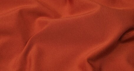 Wall Mural - Orange fabric background. Orange cloth waves background texture. Orange fabric cloth textile material.