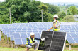 © somchai20162516 - A team of male engineers is about to install solar panels. at the solar power station Engineer team ordered and installed solar cells.