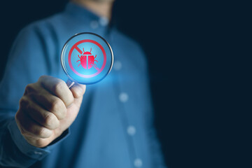 Software security, Software development and debugging concept, Person hand using laptop computer with bug software icon on screen