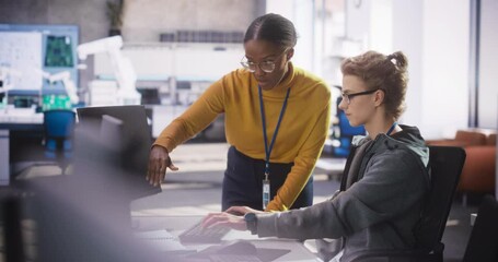 Poster - African Female Manager Having a Conversation with Young Intern Specialist in a Creative Agency, Collaborating on a Technology Project. Diverse Young Professionals Preparing for Software Presentation