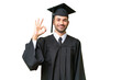 © luismolinero - Young university graduate man over isolated background showing ok sign with fingers
