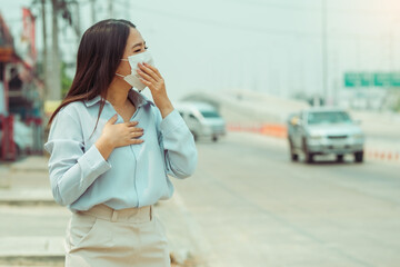 asian women wearing protection mask feels headaches and cough due to air pollution pm 2.5 air pollut