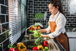 © joyfotoliakid - Hand of maid washing tomato fresh vegetables preparation healthy food in kitchen