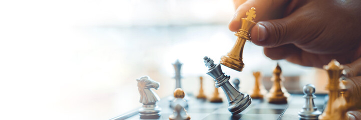 Businessman playing chess game Planning of leading strategy successful business leader concept