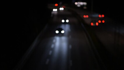 Wall Mural - Out of focus lights from traffic on a highway at night
