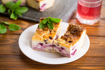 Wall Mural - cooked cottage cheese casserole with berry filling in a plate