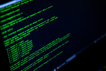 Software source code. Program code. Code on a computer screen. The developer is working on program codes in the office. Photo with source code.