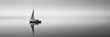  White Image Of A Lone Sailboat On A Calm Sea. AI Generative