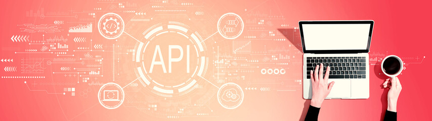 API - application programming interface concept with person using a laptop