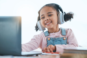 Computer, headphones and child listening in virtual class for e learning, language translation or knowledge at home. Happy kid on audio technology, laptop and online education for English development