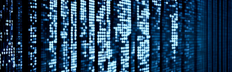 Blue digital binary data on computer screen with bokeh. Abstract information technology background. Digital binary code matrix background. dotted blue digital technology background
