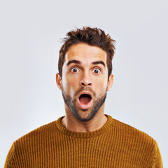 shock, surprise and portrait of a man in a studio with an amazed facial expression or attitude. shoc