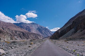 road with two sides are high mountains, and blue sky. Beautiful scenery on the way to pangong lake, Leh, Ladakh, Jammu and Kashmir, India