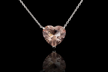 Wall Mural - beautiful Morganite pendant in gold with a chain on a black background