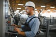 © Serhii - Factory worker. Man working on the production line.