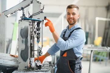 Wall Mural - Factory worker. Man working on the production line.