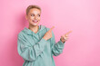 © deagreez - Photo of curious looking interested young woman wear khaki pullover point fingers mockup good economic news isolated on pink color background