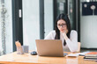 © PRIME STOCK LAB - Professional millennial Accountant Woman in casuals working on financial analysis documents with a tense expression in the office.
