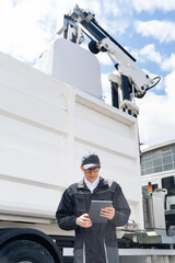 Sticker - Manager with a digital tablet next to garbage truck. 