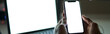 © Kostiantyn - Using gadgets. Close up shot of blank white screen of smarthone. Man sitting in dark room in front of many computer monitors while working alone late at night