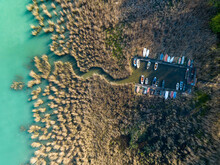 Hungary - Lake Balaton Beach Textures With Boats With Reeds And Piers From Drone View