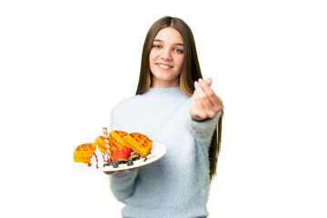 Sticker - Teenager girl holding waffles over isolated chroma key background making money gesture