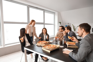 Wall Mural - Group of business people with tasty pizza in office