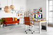 © Pixel-Shot - Interior of office with graphic designer's workplace, shelves and sofa