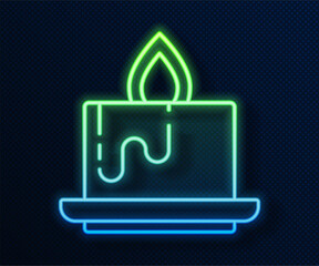 Poster - Glowing neon line Aroma candle icon isolated on blue background. Vector