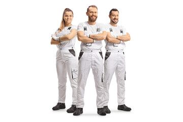Wall Mural - Team of house painters in white overall pants smiling at camera