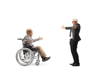 Mature businessman meeting an elderly man in a wheelchair