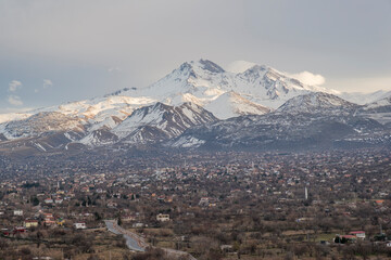 Wall Mural - Erciyes Mount with from Kayseri. Height of 3,864 metres is the highest mountain in Cappadocia and central Anatolia. It is a volcano. Hacilar city