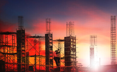 Wall Mural - Silhouette engineer work on high ground heavy industry and safety concept over blurred natural background sunset pastel
