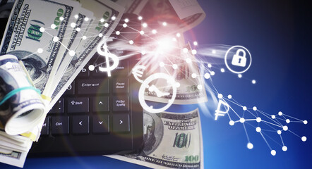 The work of a programmer and blogger on the Internet. Computer keyboard and a scattering of 100 dollar bills on the table.