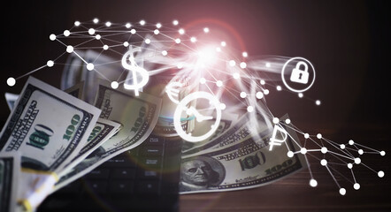 The work of a programmer and blogger on the Internet. Computer keyboard and a scattering of 100 dollar bills on the table.