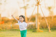Freedom style of asia baby cute girl run play on a the outdoor playground with happy time on evening time