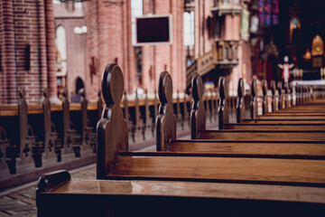 Wall Mural - Rows of church benches at the old european catholic church. 