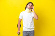 Young handsome man wearing neck brace and crutches isolated on yellow background with headache