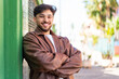 © luismolinero - Handsome Arab man at outdoors with arms crossed and looking forward