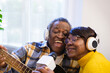 © Ivan - Senior couple singing karaoke and sharing moments of quality and fun. Concept: lifestyle, happiness, eternal