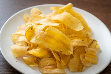 Wall Mural - Banana Chips - fried or baked sliced banana