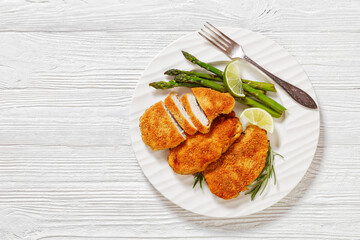 Poster - breaded chicken breasts with asparagus and lime