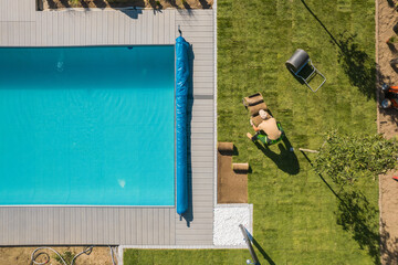 Wall Mural - Aerial View of a Poolside and Grass Turfs Installation