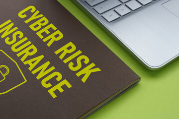 Wall Mural - Cyber Risk Insurance is shown using the text and photo of laptop