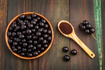 Wall Mural - Amazonian acai berries and powder - Euterpe oleracea