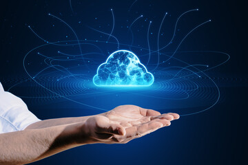 Close up of male hand holding digital polygonal cloud with lines on blue background. Cloud storage and computing concept.